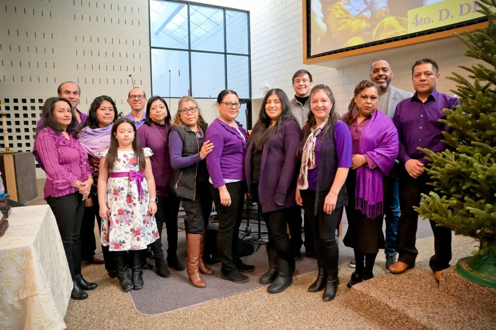 A group of people wearing purple clothes.