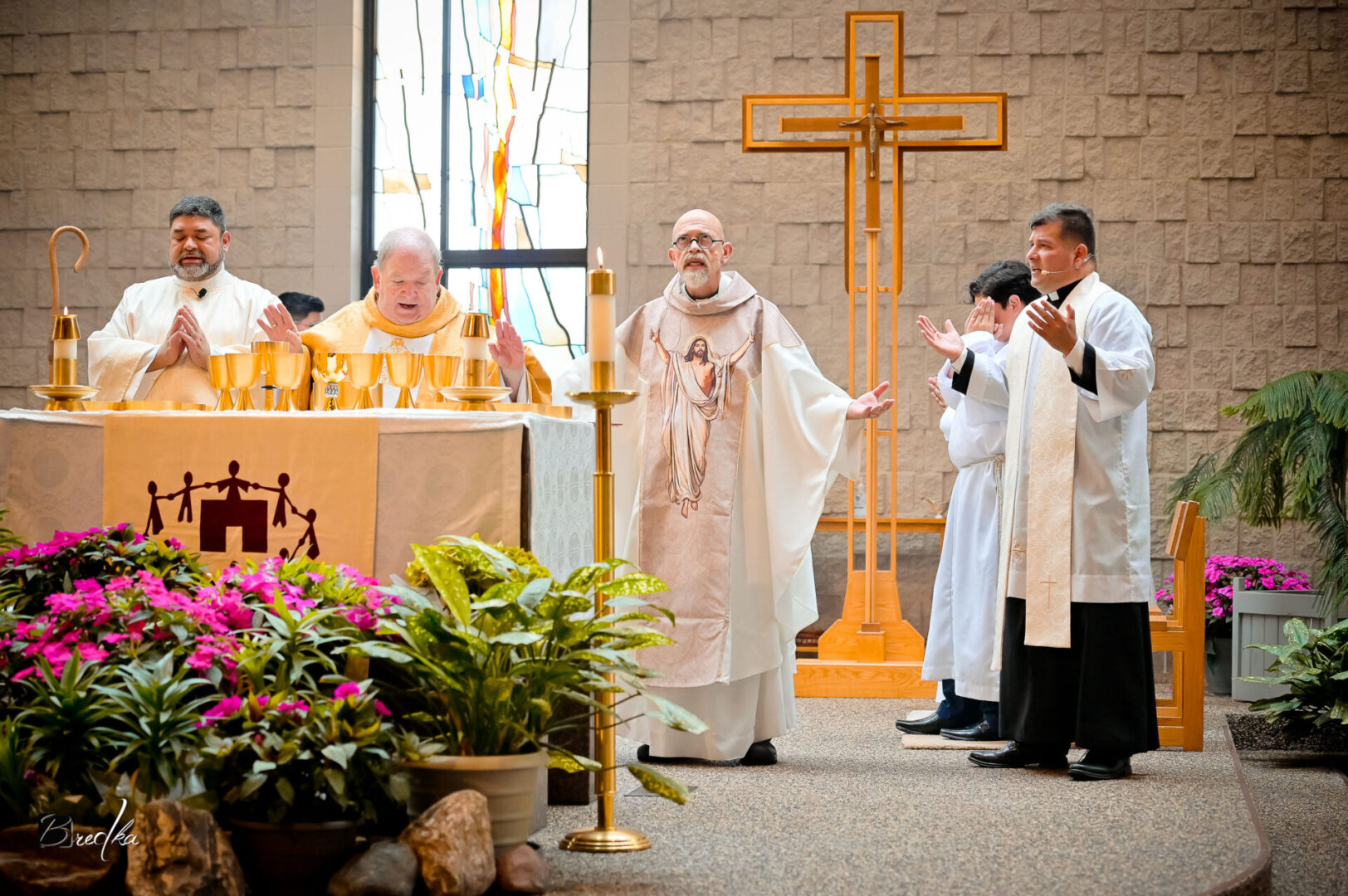 Four priests performing a church service.