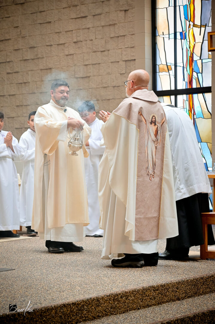 Priest censing during a Catholic mass.