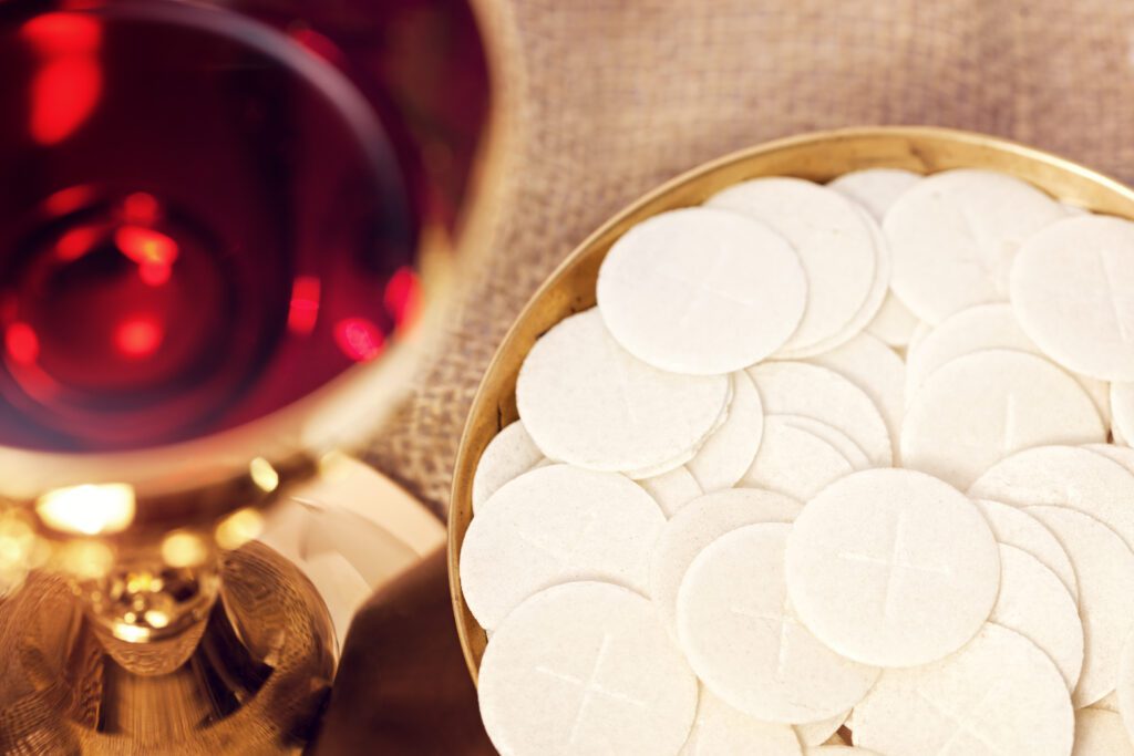 Communion wafers and chalice of wine.