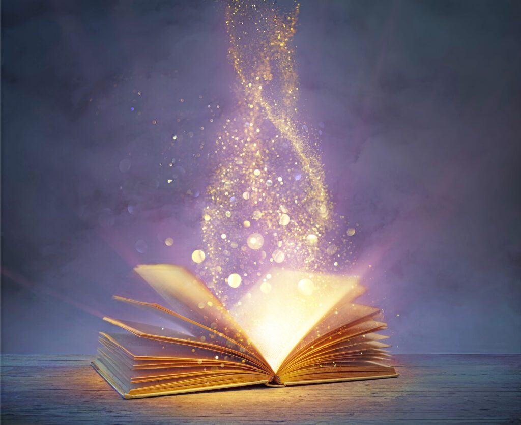 Magic Old Book With Open Pages And Abstract Bokeh Lights Shining In Darkness - Literature And Fairytale Concept